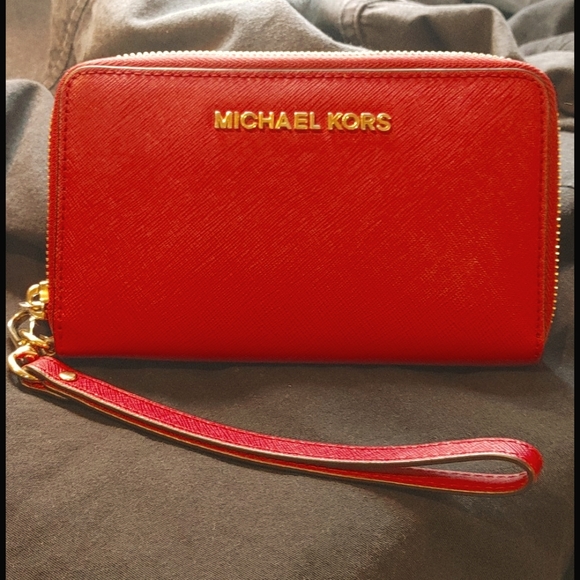 Michael Kors Handbags - Michael Kors Jetsetter Wristlet in red